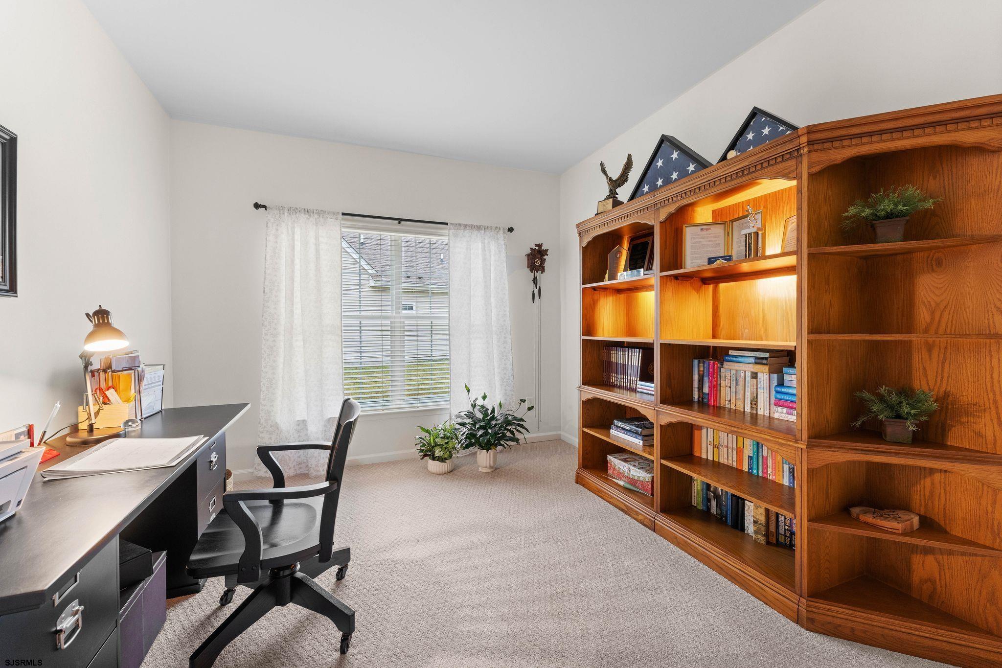 11 Daffodil Road Egg Harbor Township, NJ 08234 - Photo 22 of 50 a workspace room with furniture and book shelf