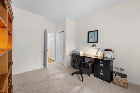 a view of a workspace with furniture