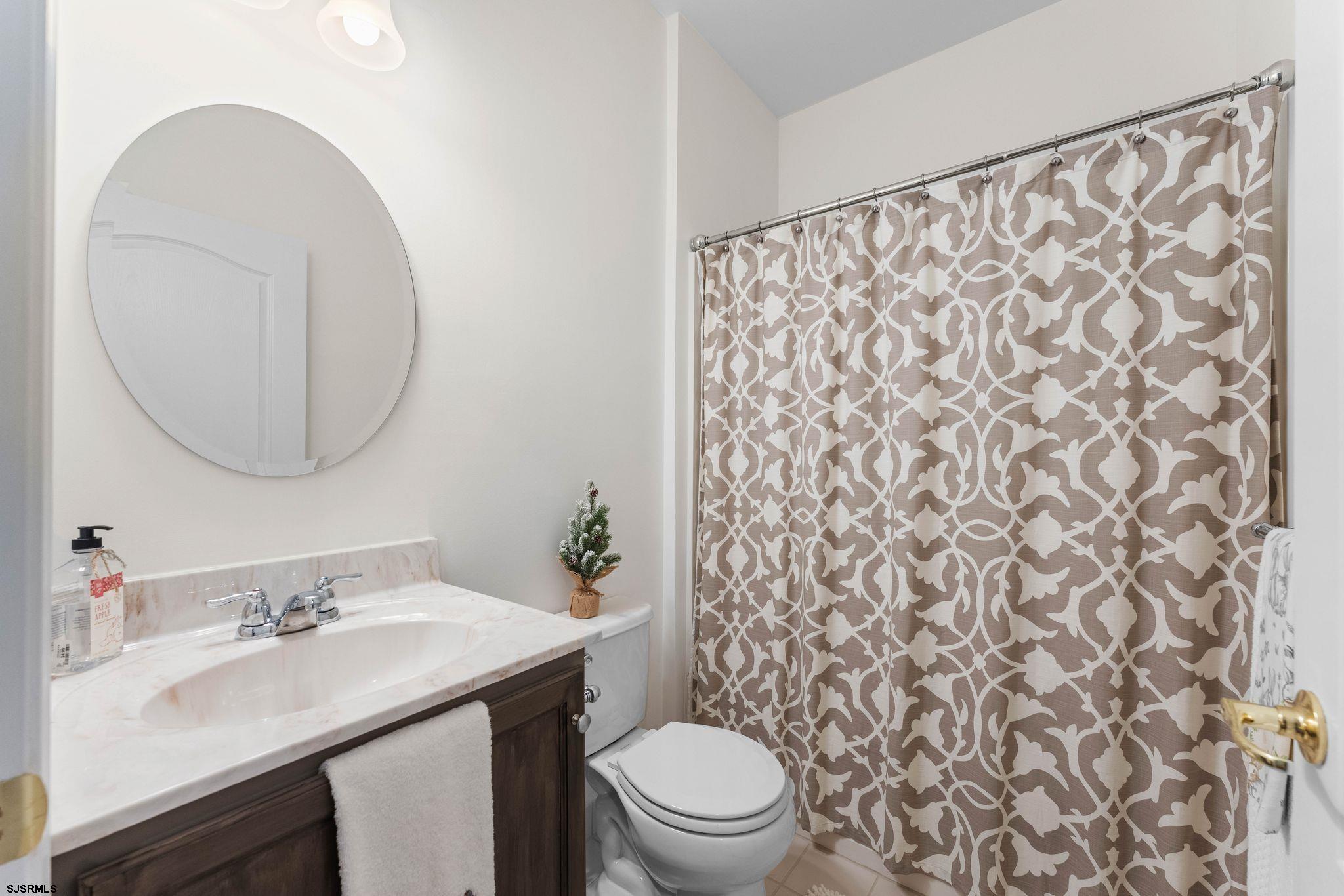 11 Daffodil Road Egg Harbor Township, NJ 08234 - Photo 24 of 50 a bathroom with a sink toilet and a mirror