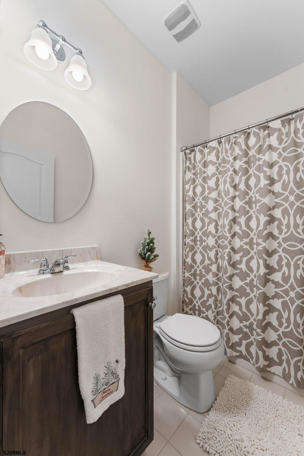 11 Daffodil Road Egg Harbor Township, NJ 08234 - Photo 25 of 50 a bathroom with a sink a toilet and a mirror
