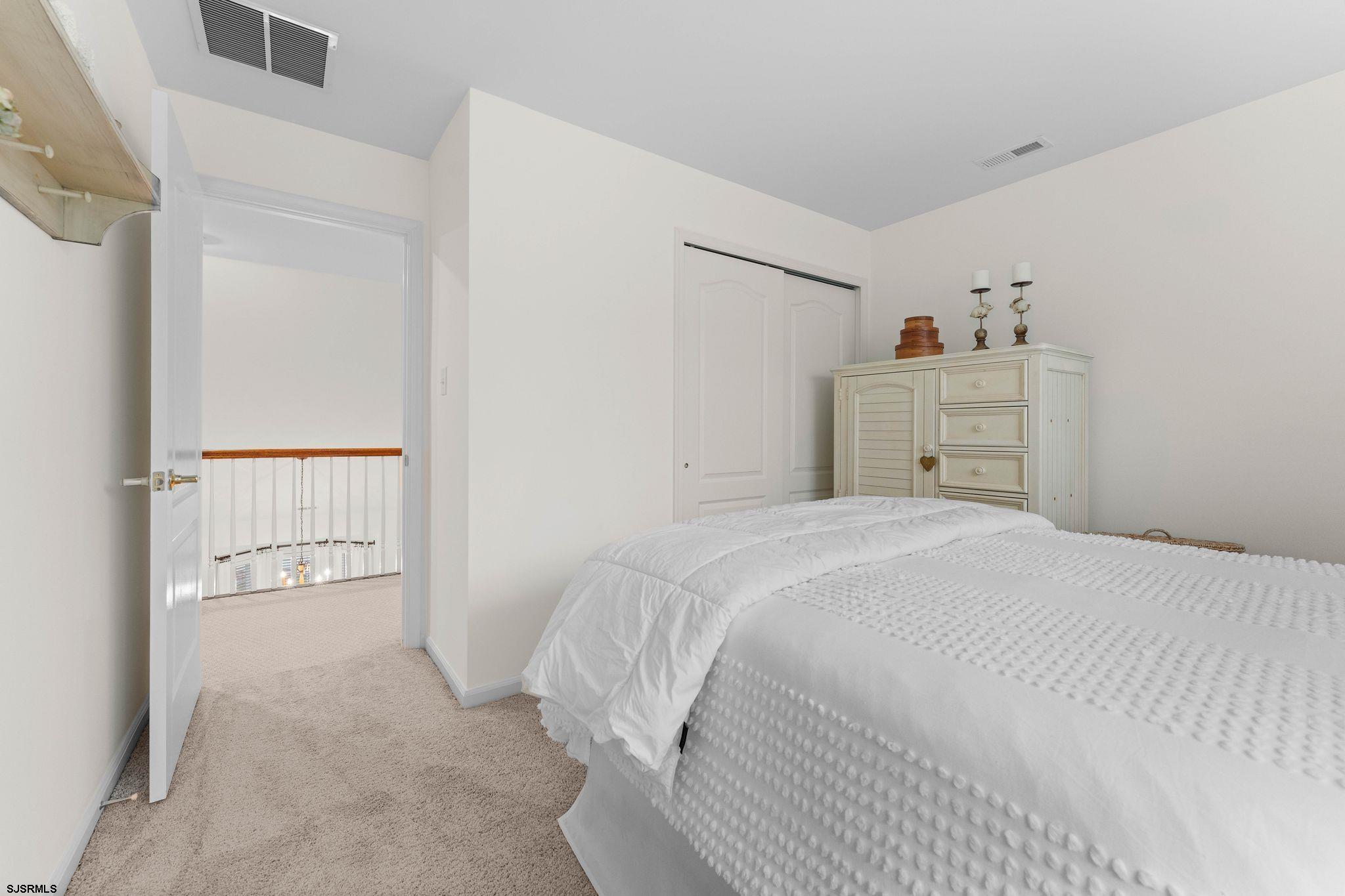 11 Daffodil Road Egg Harbor Township, NJ 08234 - Photo 29 of 50 a bedroom with a bed and a cabinets