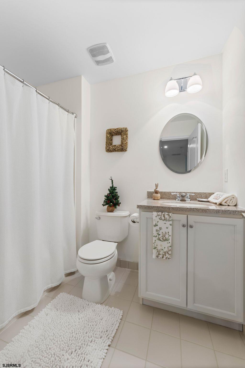 11 Daffodil Road Egg Harbor Township, NJ 08234 - Photo 30 of 50 a bathroom with a granite countertop toilet sink and mirror