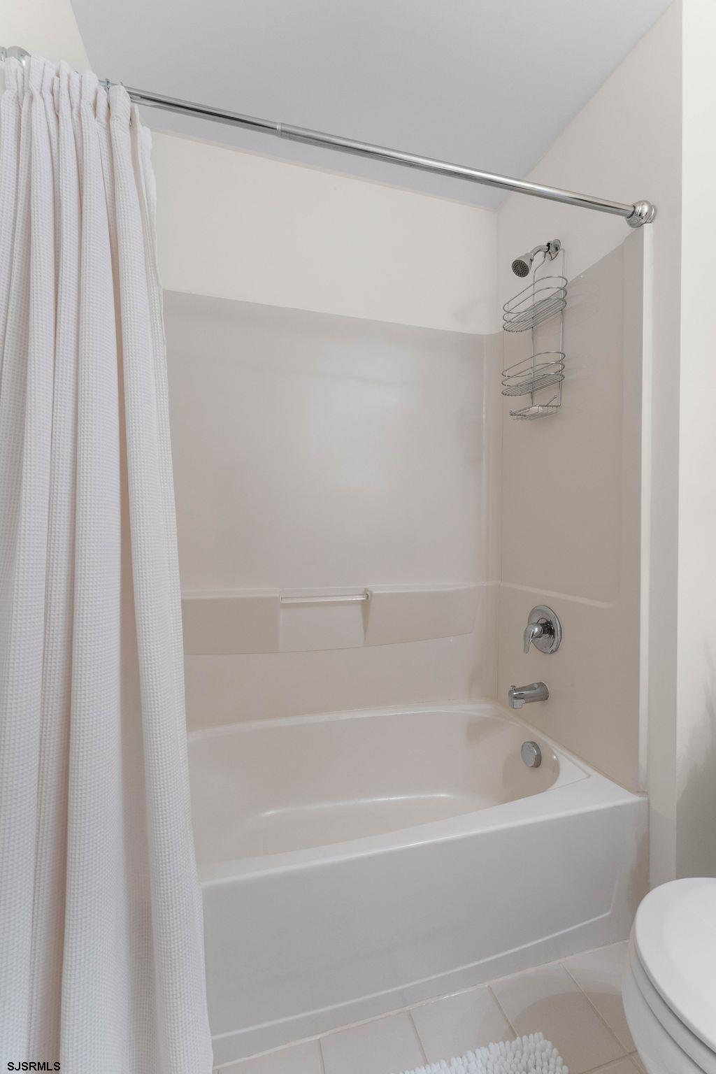 11 Daffodil Road Egg Harbor Township, NJ 08234 - Photo 31 of 50 a bathroom with a shower and a bath tub