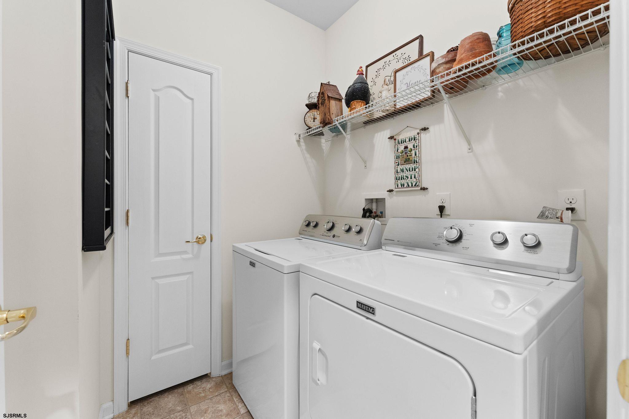 11 Daffodil Road Egg Harbor Township, NJ 08234 - Photo 32 of 50 a utility room with dryer and washer