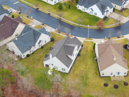 an aerial view of a house with swimming pool