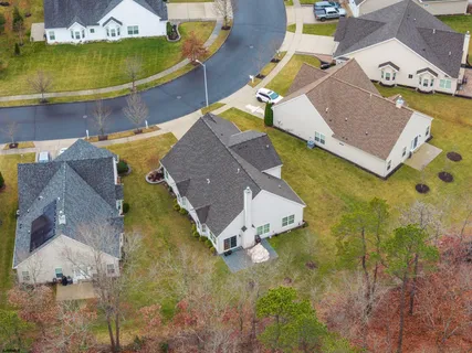 an aerial view of residential house with outdoor space