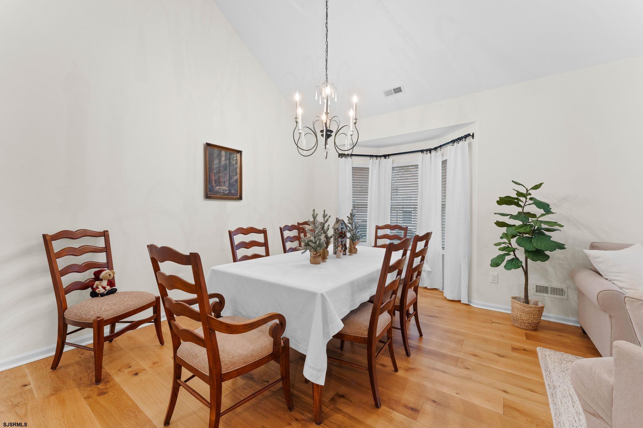 11 Daffodil Road Egg Harbor Township, NJ 08234 - Photo 8 of 50 a view of a dining room with furniture and chandelier