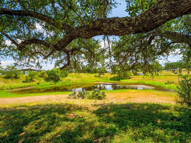 a front view of a house with a big yard