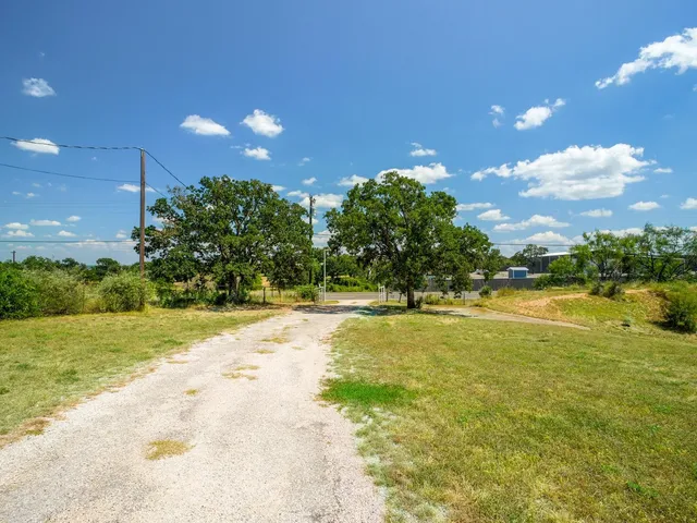 a view of a yard with table and chairs