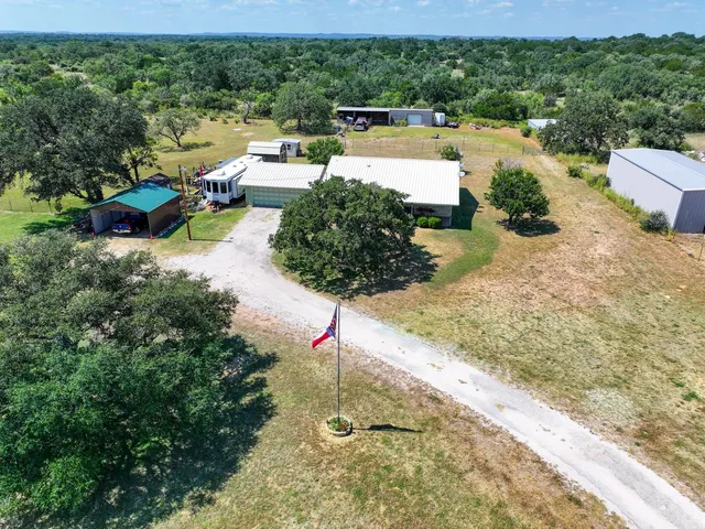 an aerial view of residential houses with outdoor space
