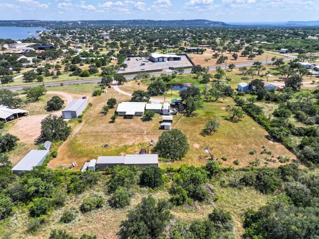 an aerial view of residential houses with outdoor space