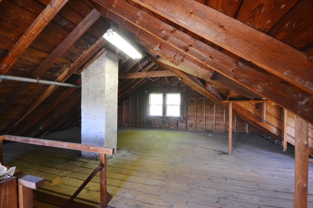 122 Morningside Road Worcester, MA 01602 - Photo 34 of 35 a view of an empty room with wooden floor and a window