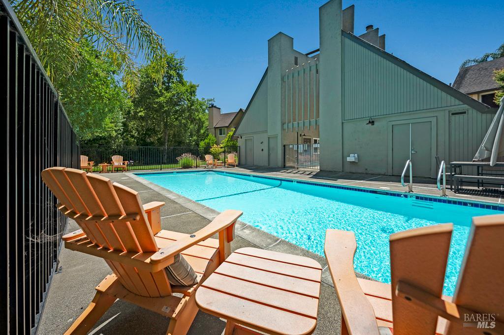 204 Foss Creek Circle, Unit B Healdsburg, CA 95448 - Photo 16 of 19 a view of pool with lawn chairs and plants