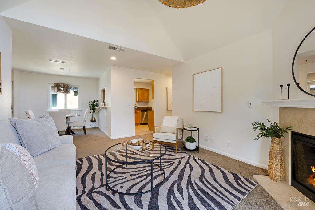 204 Foss Creek Circle, Unit B Healdsburg, CA 95448 - Photo 8 of 19 a living room with furniture and a fireplace