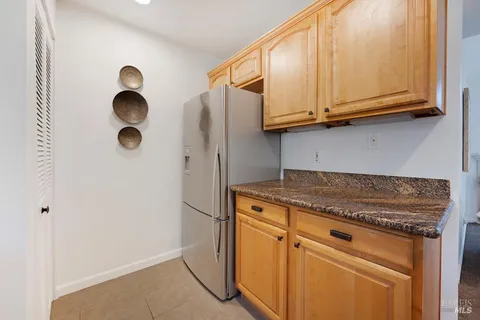 a kitchen with granite countertop cabinets and appliances