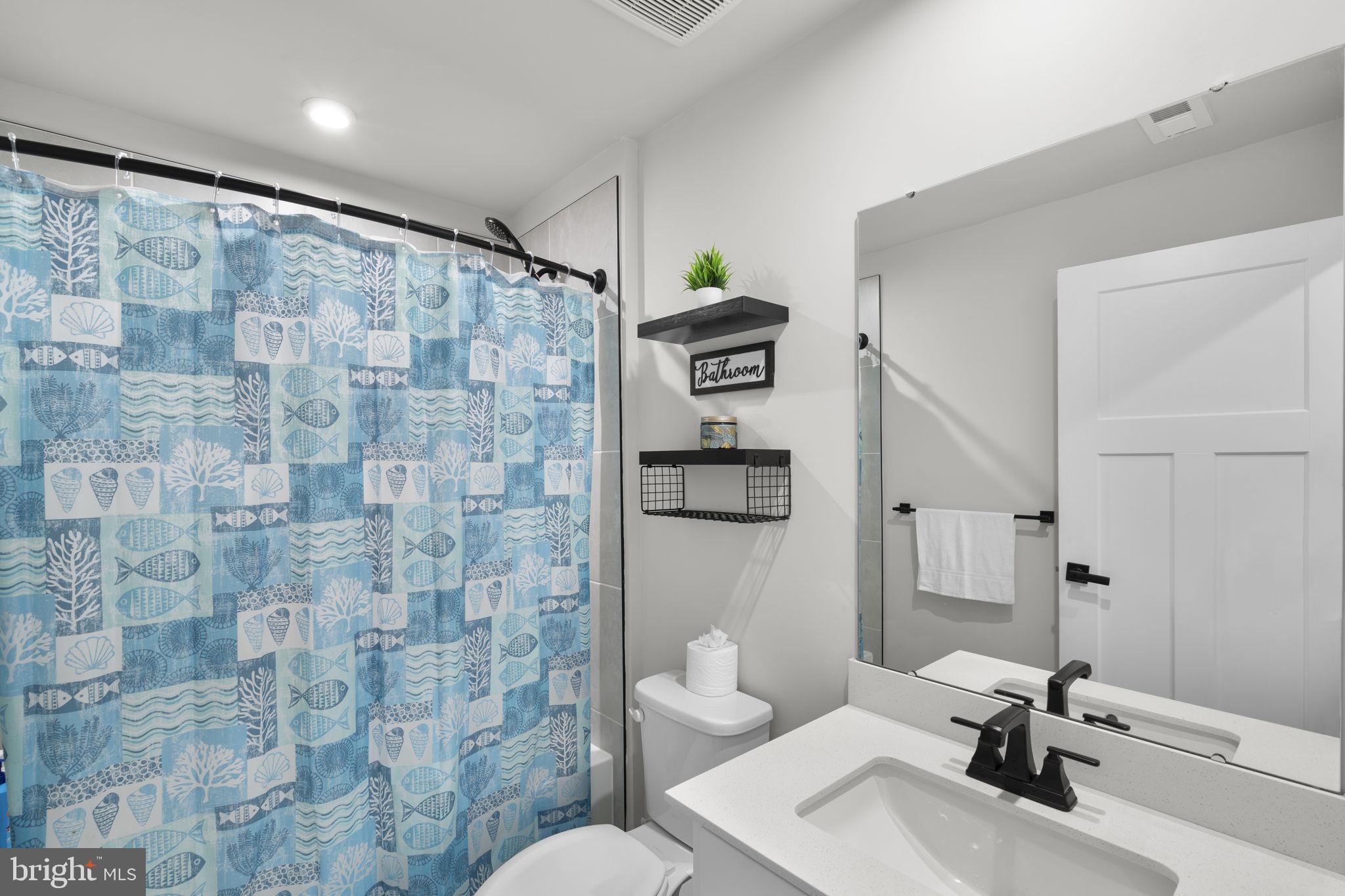 1713 Aurora Way Frederick, MD 21702 - Photo 49 of 57 a bathroom with a sink toilet and shower