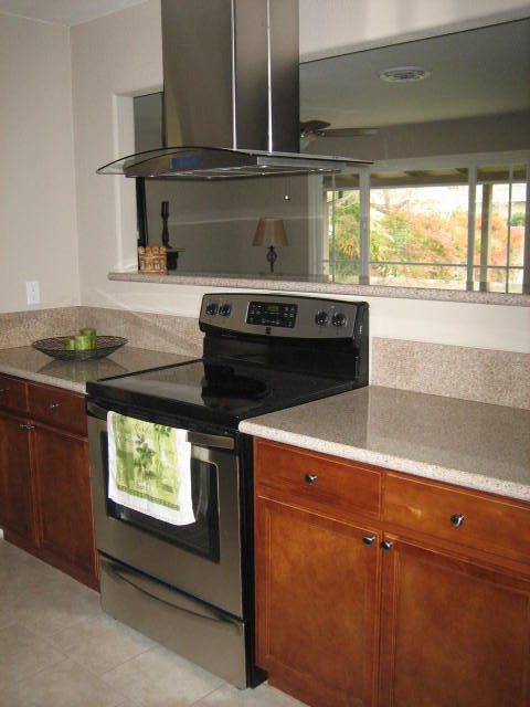 2610 Irwin Road Redding, CA 96002 - Photo 12 of 27 a kitchen with stainless steel appliances granite countertop a stove and a microwave
