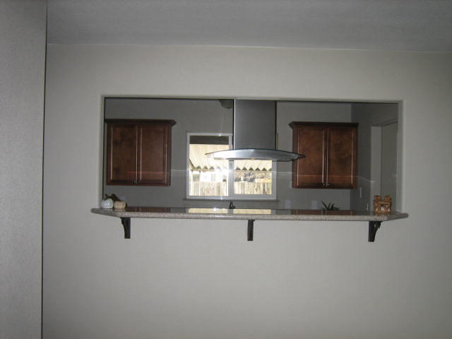2610 Irwin Road Redding, CA 96002 - Photo 15 of 27 an empty room with wooden floor and window