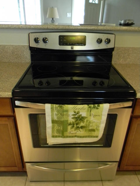 2610 Irwin Road Redding, CA 96002 - Photo 16 of 27 a stove top oven sitting inside of a kitchen