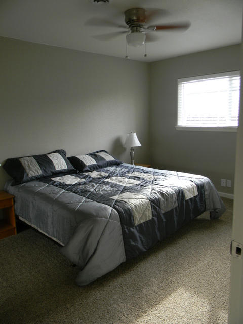 2610 Irwin Road Redding, CA 96002 - Photo 17 of 27 a bedroom with a bed and window