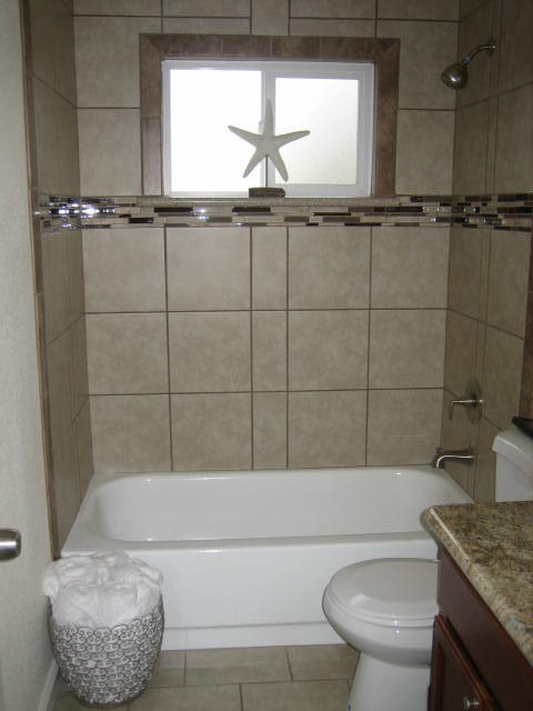 2610 Irwin Road Redding, CA 96002 - Photo 21 of 27 a bathroom with a granite countertop bathtub shower sink vanity and toilet