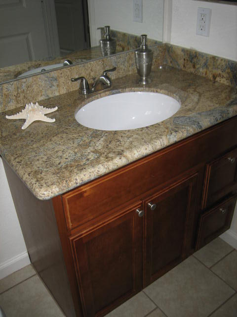 2610 Irwin Road Redding, CA 96002 - Photo 23 of 27 a bathroom with a granite countertop sink and a mirror