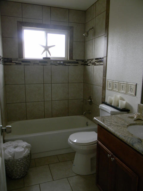 2610 Irwin Road Redding, CA 96002 - Photo 24 of 27 a bathroom with a granite countertop bathtub sink vanity mirror and toilet