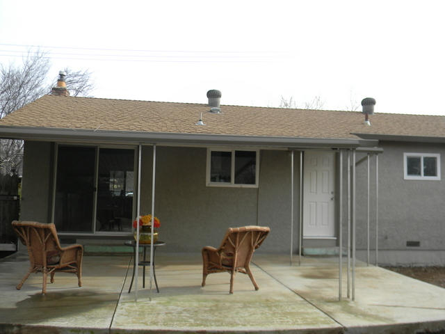 2610 Irwin Road Redding, CA 96002 - Photo 25 of 27 a backyard of a house with table and chairs