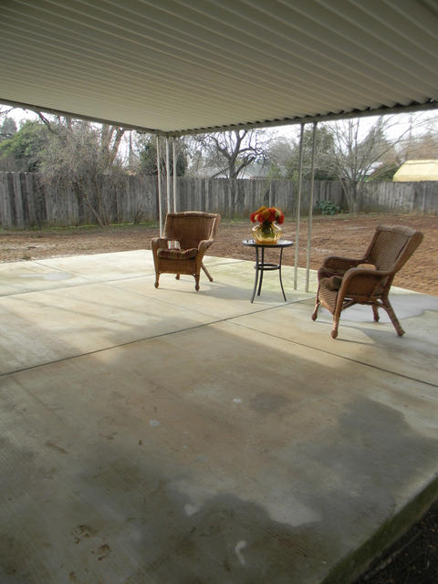 2610 Irwin Road Redding, CA 96002 - Photo 26 of 27 a patio with a yard table and chairs