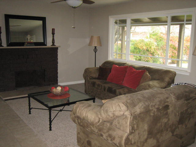 2610 Irwin Road Redding, CA 96002 - Photo 6 of 27 a living room with furniture and a flat screen tv