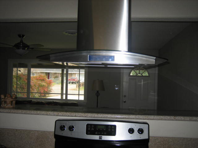 2610 Irwin Road Redding, CA 96002 - Photo 9 of 27 a stove top oven sitting inside of a kitchen