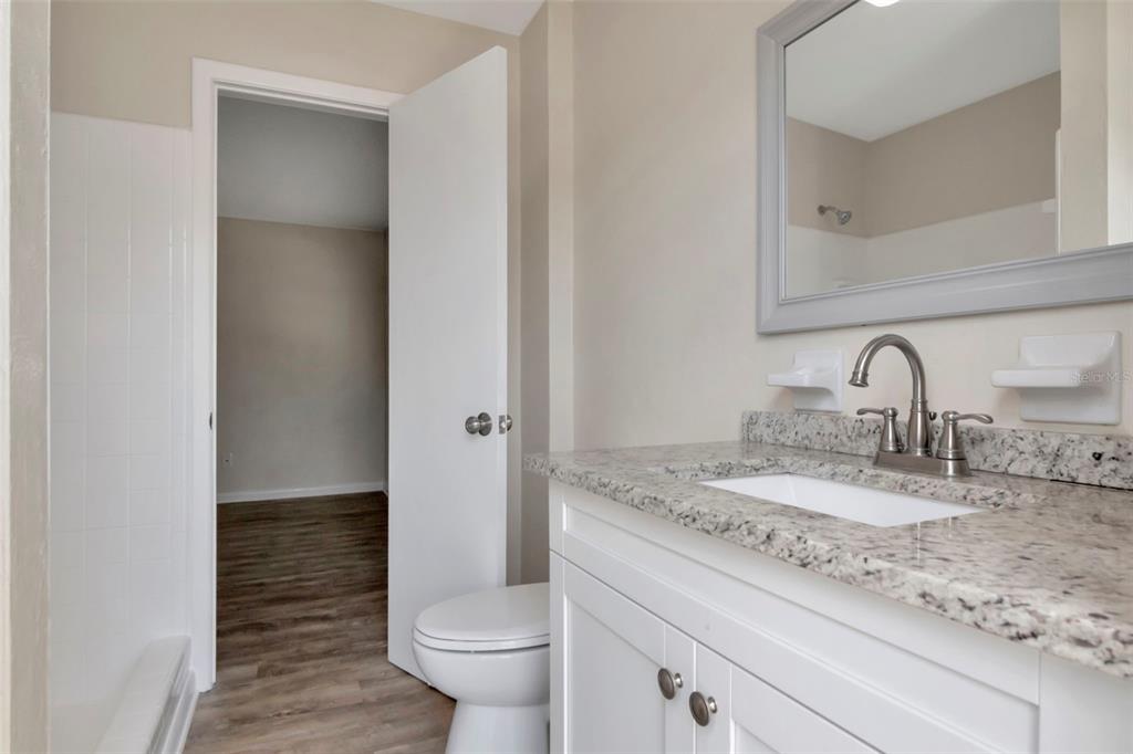 126 Kingsway Road Brandon, FL 33510 - Photo 33 of 42 a bathroom with a sink and toilet