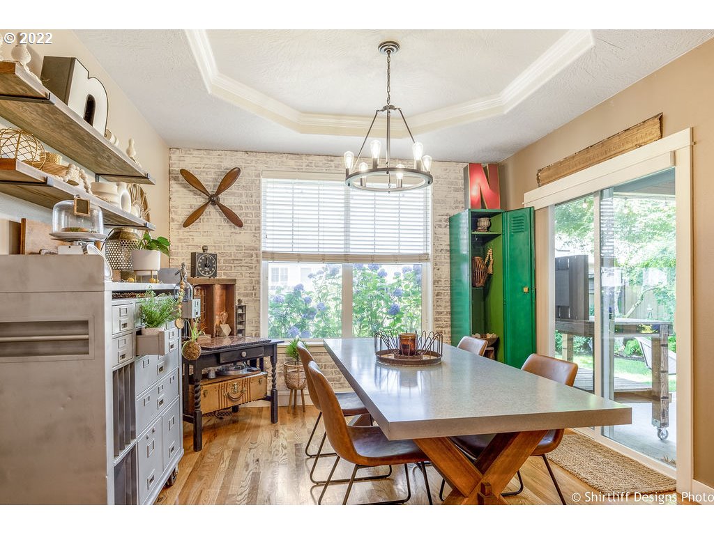 7184 F Place Springfield, OR 97478 - Photo 6 of 32 a dining room with furniture a chandelier and window