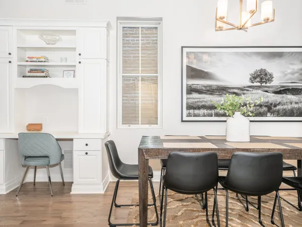 a dining room with furniture and window