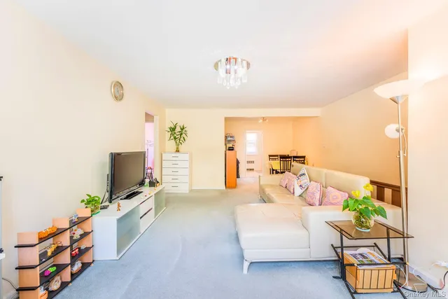 a bedroom with furniture and a flat screen tv