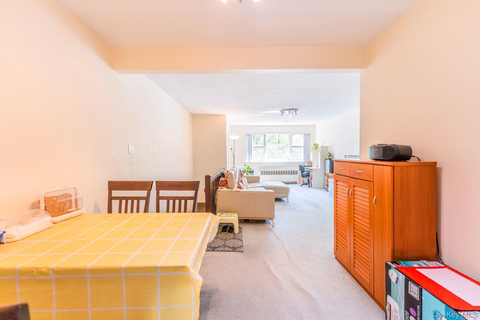 69-28 Kissena Boulevard, Unit 130B Queens, NY 11367 - Photo 16 of 20 a spacious bedroom with a bed and wooden floor