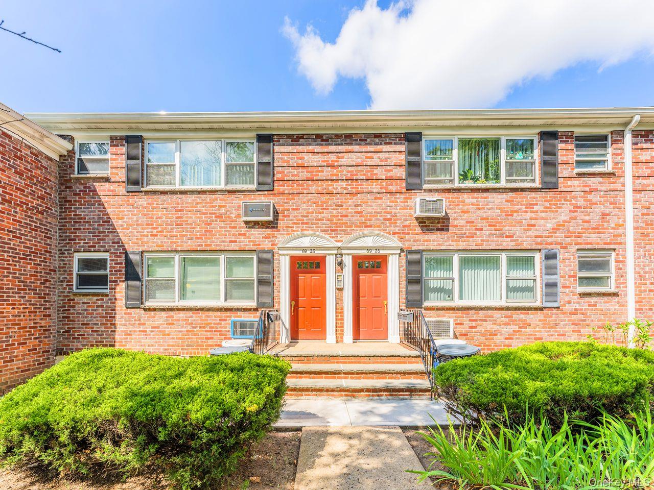 69-28 Kissena Boulevard, Unit 130B Queens, NY 11367 - Photo 18 of 20 a front view of a house with a yard