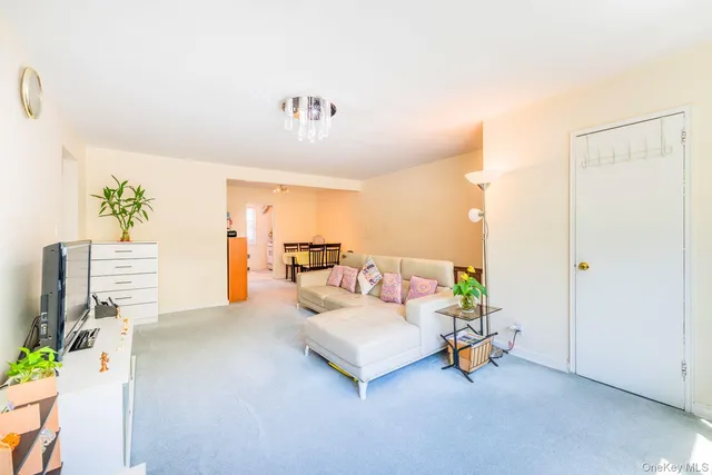 a living room with furniture and a table