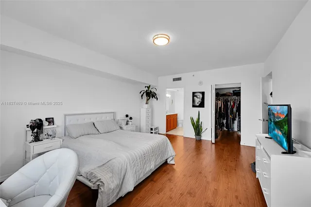 a room with a bed and a window