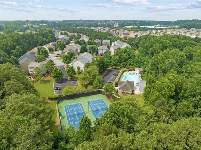 an aerial view of a house with a yard