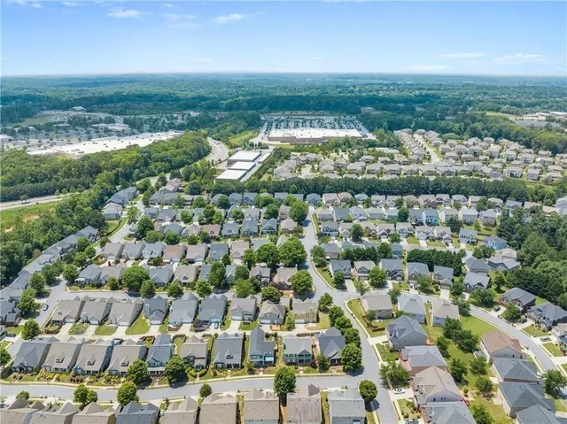 an aerial view of residential houses with outdoor space
