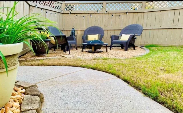 a view of swimming pool with a table and chairs