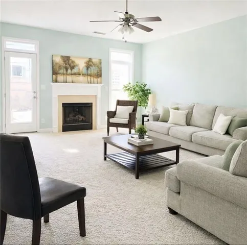 a living room with furniture and a fireplace