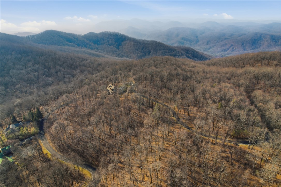 116 Witch Hazel Trail Landrum, SC 29356 - Photo 12 of 26 This elevated view captures the extensive forest and mountain vistas surrounding the property.