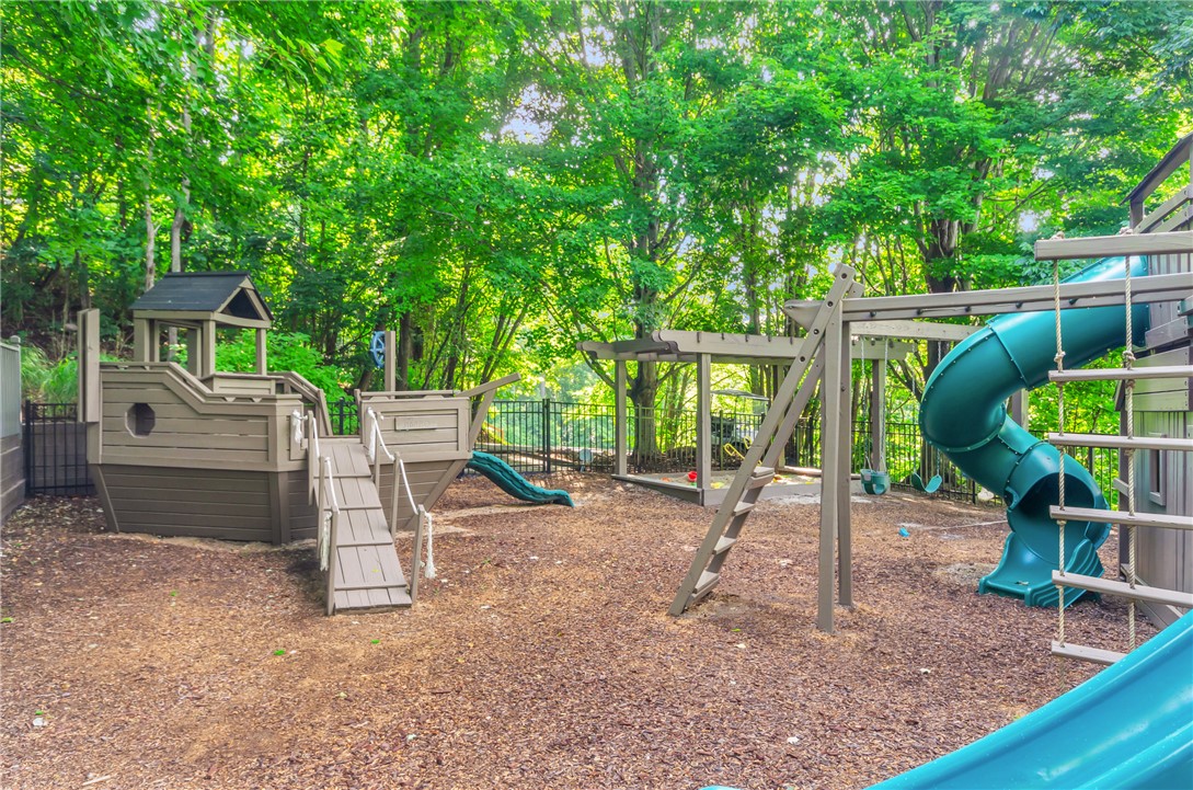 116 Witch Hazel Trail Landrum, SC 29356 - Photo 24 of 26 This playful outdoor area features a boat-themed structure and a vibrant slide.