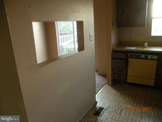 2402 Ridgely Street Baltimore, MD 21230 - Photo 3 of 10 a bathroom with a sink and a mirror