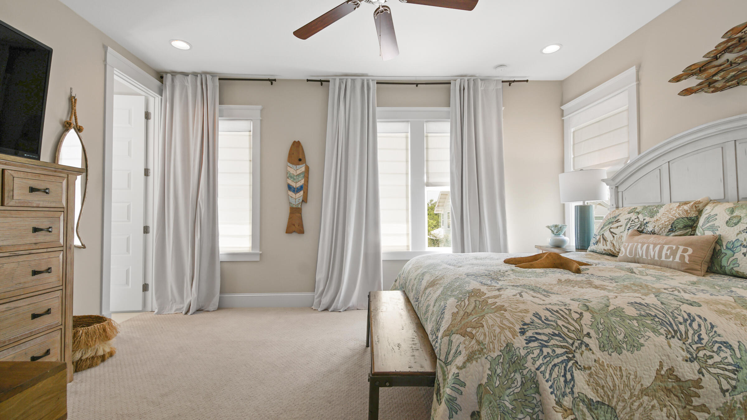20 Federal Street Inlet Beach, FL 32461 - Photo 25 of 41 a bedroom with a bed a dresser and a chandelier