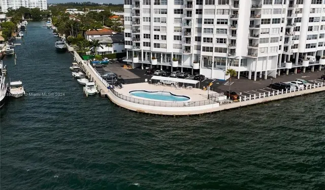 a terrace with seating area and lake view