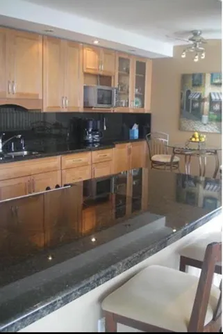a kitchen with a window and cabinets