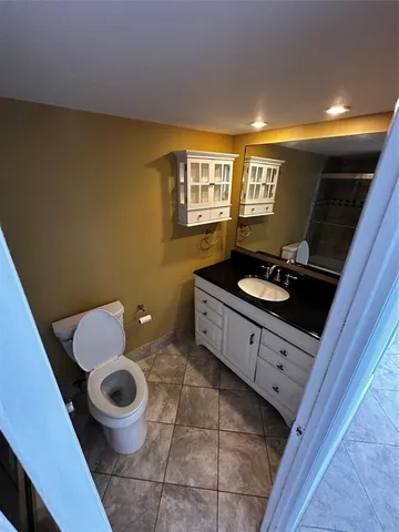 a kitchen with a sink a stove and a wooden cabinets